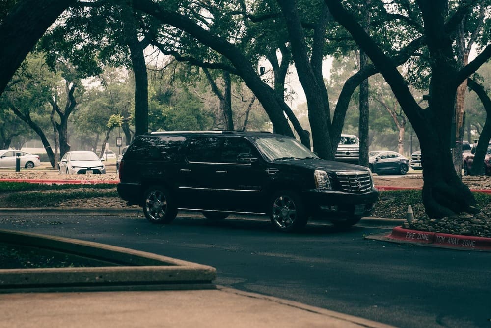 luxurious black SUV with a private driver on a parking lot in Gunacaste, coasta rica